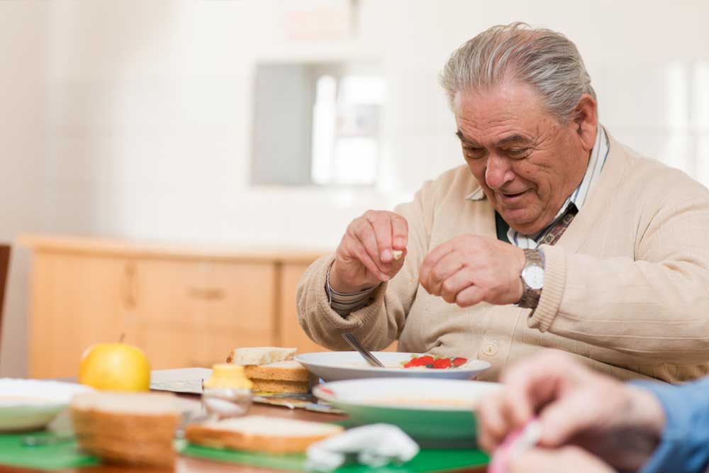 Senior man eating a healthy meal